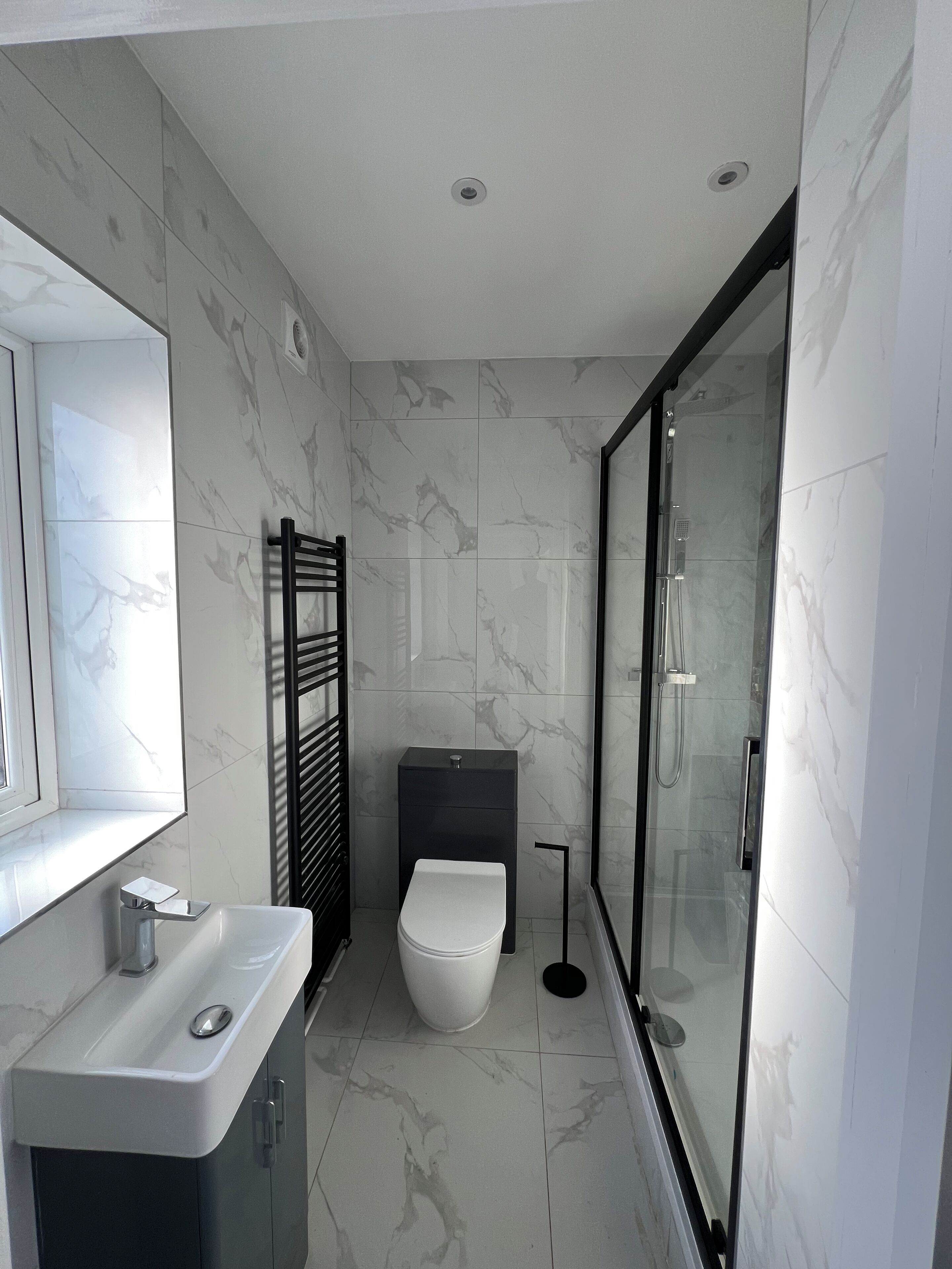 Shower, hair dryer, towels, toilet paper