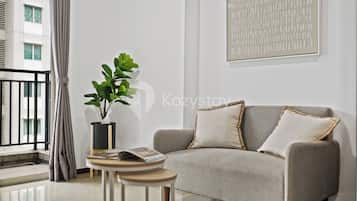 Apartment, 1 Bedroom, City View | Living area | Flat-screen TV