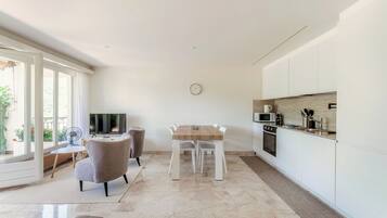 Superior Apartment | Living area | 32-inch flat-screen TV with digital channels