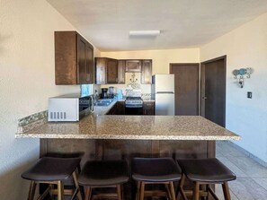 Fridge, microwave, stovetop, coffee/tea maker