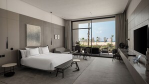 A modern hotel room with a large bed, a desk, and a view of the beach. - My Ōtel North Coast (El Dabaa)