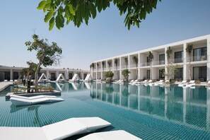 2 outdoor pools, open 7:00 AM to 6:00 PM, pool umbrellas, pool loungers