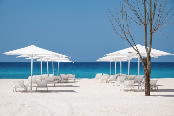 Private beach, white sand, sun loungers, beach umbrellas