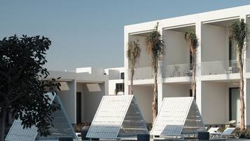 2 outdoor pools, open 7:00 AM to 6:00 PM, pool umbrellas, sun loungers