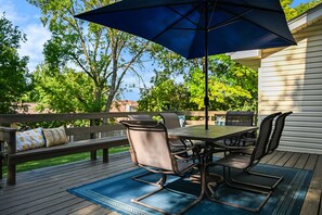 Outdoor dining - Stylish 4BR Getaway w/ Hot Tub & Grill! (Omaha)