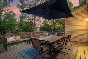 Outdoor dining - Stylish 4BR Getaway w/ Hot Tub & Grill! (Omaha)