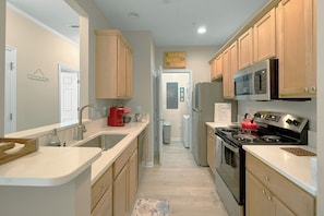 Microwave, stovetop, dishwasher, coffee/tea maker
