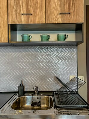 Fridge, microwave, electric kettle, cookware/dishes/utensils