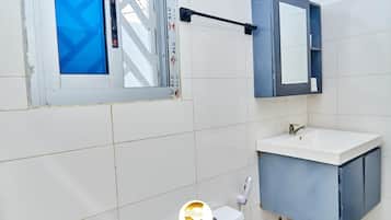 Shower, towels, soap, toilet paper