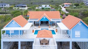 A beachfront property with a pool, covered patio, and multiple rooms. - Ocean Whisper Villa in Sint Willibrordus (St. Marie)