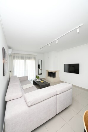 Deluxe Apartment, Balcony | Living area