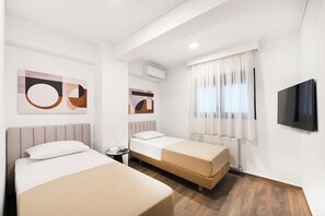 Appartement Deluxe | Espace de travail pour ordinateur portable, fer et planche à repasser