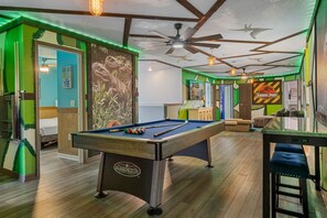 A pool table in a room with green walls and a ceiling fan. - Sleeps 25•Game Room•Pool•Free Water Slides (Davenport)