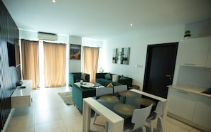 Apartment, Balcony | Living area - Signature Luxury Suites by Cozy (Accra)