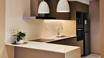 Familieleilighet, 2 soverom, balkong | Eget kjøkken | Kjøleskap, mikrobølgeovn, ovn og kokeplater