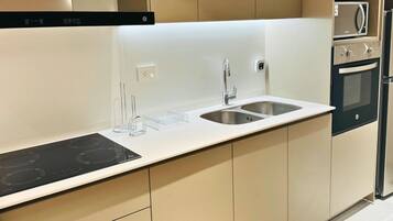 Family Apartment, 2 Bedrooms, Balcony | Private kitchen | Full-size fridge, microwave, oven, stovetop