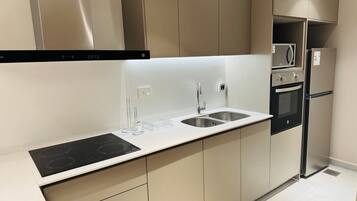 Classic Apartment, 2 Bedrooms, Balcony | Private kitchen | Full-size fridge, microwave, oven, stovetop