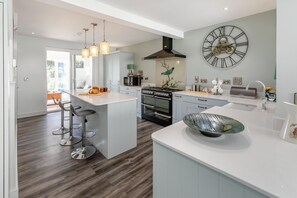 Oven, dishwasher, high chair, cookware/dishes/utensils