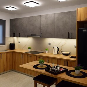 Fridge, coffee/tea maker, toaster, cookware/dishes/utensils