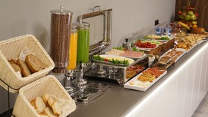A buffet with various food items and beverages. - Arbnor Boutique Hotel (Tirana)