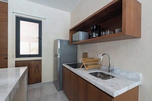 Fridge, microwave, stovetop, coffee/tea maker