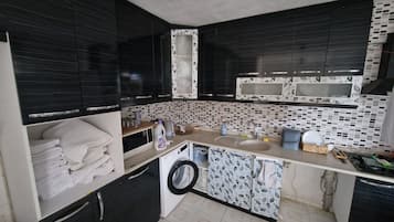 Microwave, electric kettle, cookware/dishes/utensils
