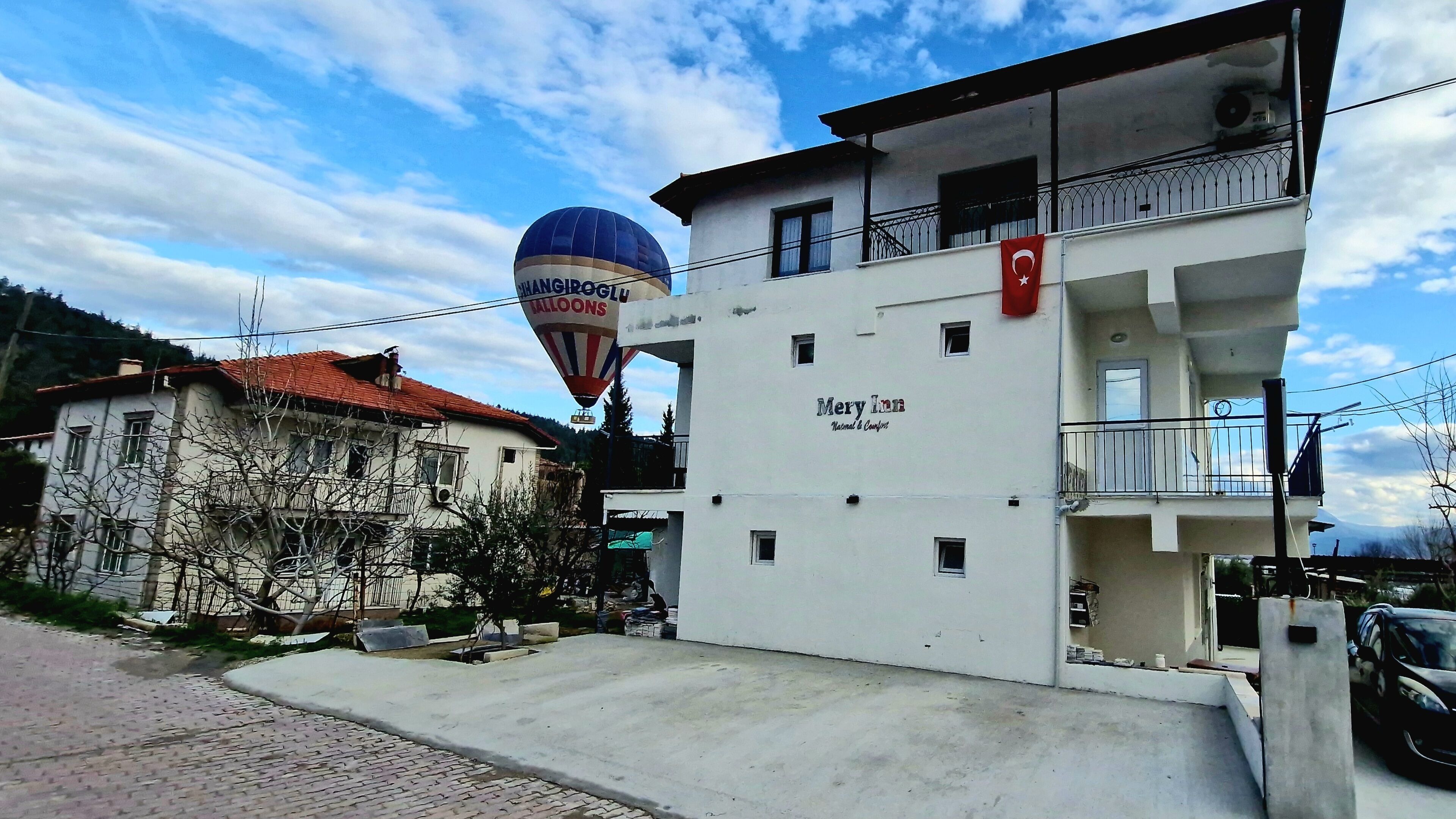 A two-story building with a sign reading "Mery Mar National & Conference."