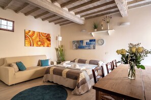 Apartment | Living area | 32-inch flat-screen TV with satellite channels