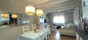 Family Apartment, 3 Bedrooms, Garden View | Living area - Apartaments La Cabana (Tarragona)
