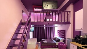 A room with a bunk bed, a desk, a chair, and a large window. - Romance Apartment (Sarande)