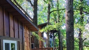 A wooden cabin with a wooden deck and a window. - Cherry Treesort "Big Nick" (Rowan County)