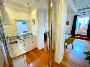 Fridge, microwave, stovetop, coffee/tea maker