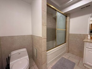 Shower, hair dryer, towels, shampoo