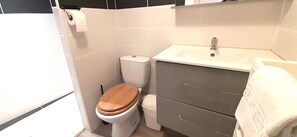 Shower, hair dryer, towels, toilet paper