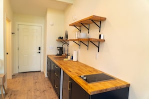 Fridge, microwave, stovetop, coffee/tea maker