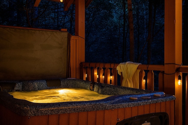 Relax in the serenity of the private back deck hot tub under the stars.