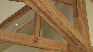 A wooden truss structure of a building's roof.