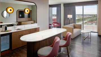 Suite (King Suite) | Living area | 45-inch flat-screen TV with satellite channels, pay movies
