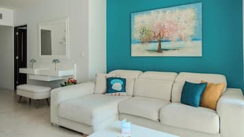 Superior Apartment, Garden View | Living area | 80-cm TV with digital channels