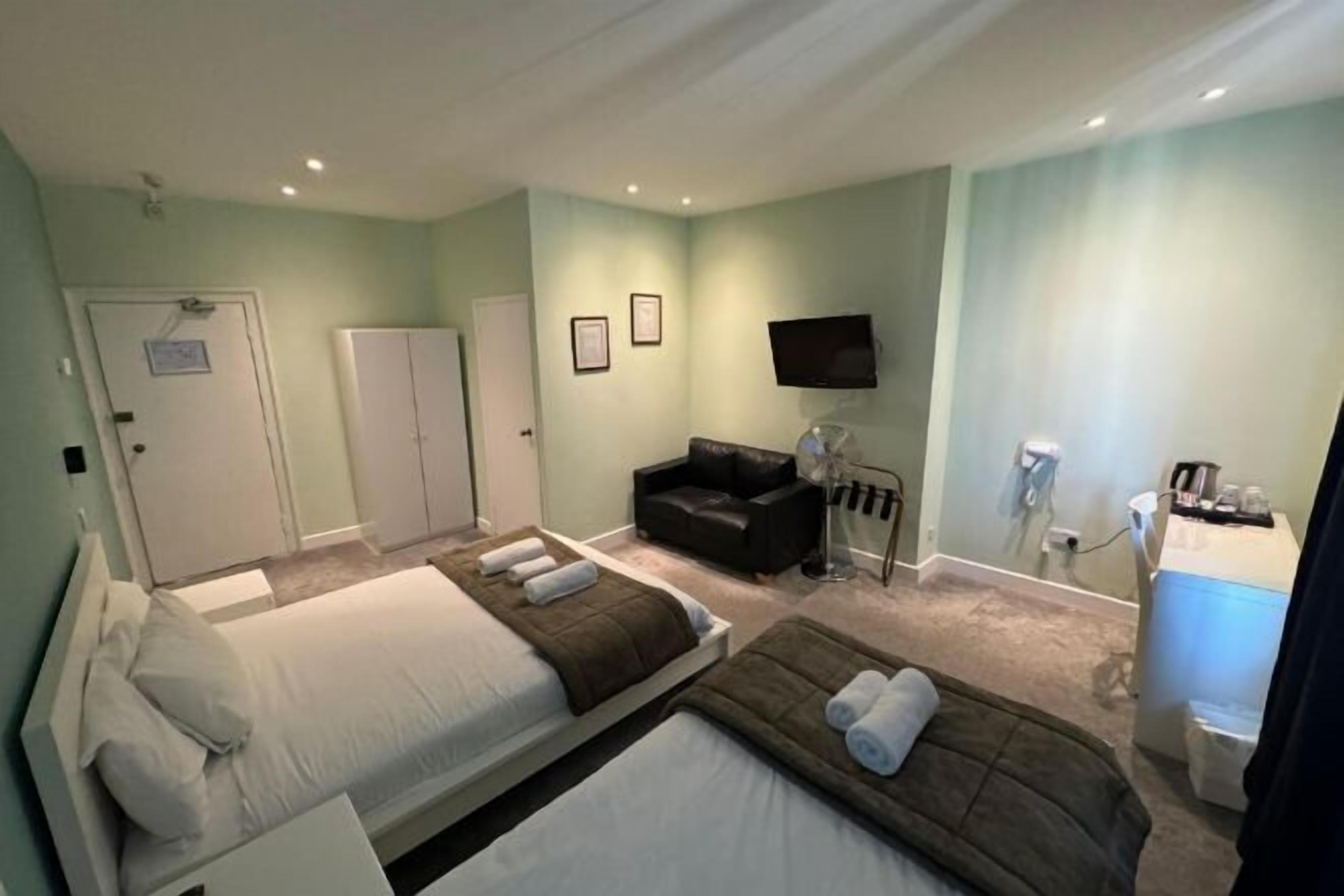 Desk, laptop workspace, blackout drapes, iron/ironing board