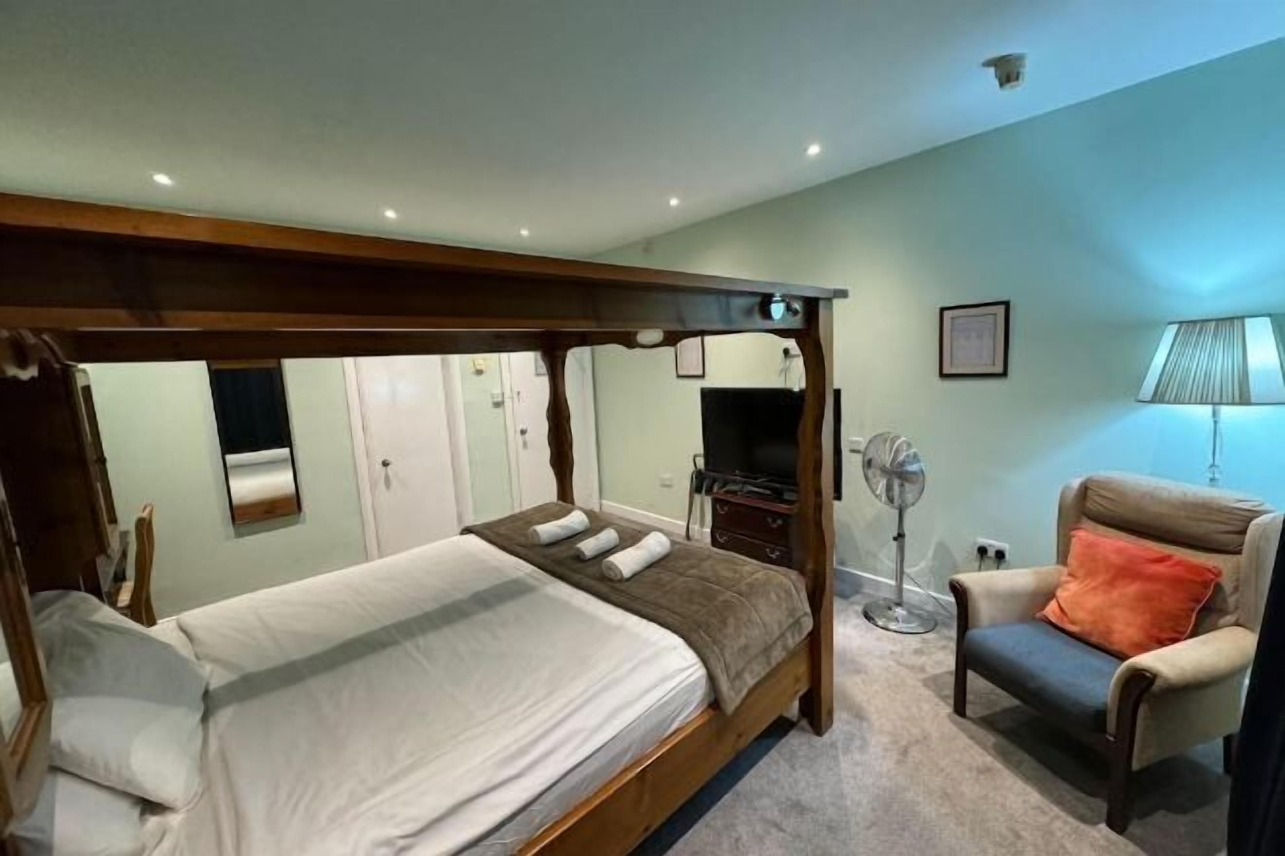 Desk, laptop workspace, blackout drapes, iron/ironing board