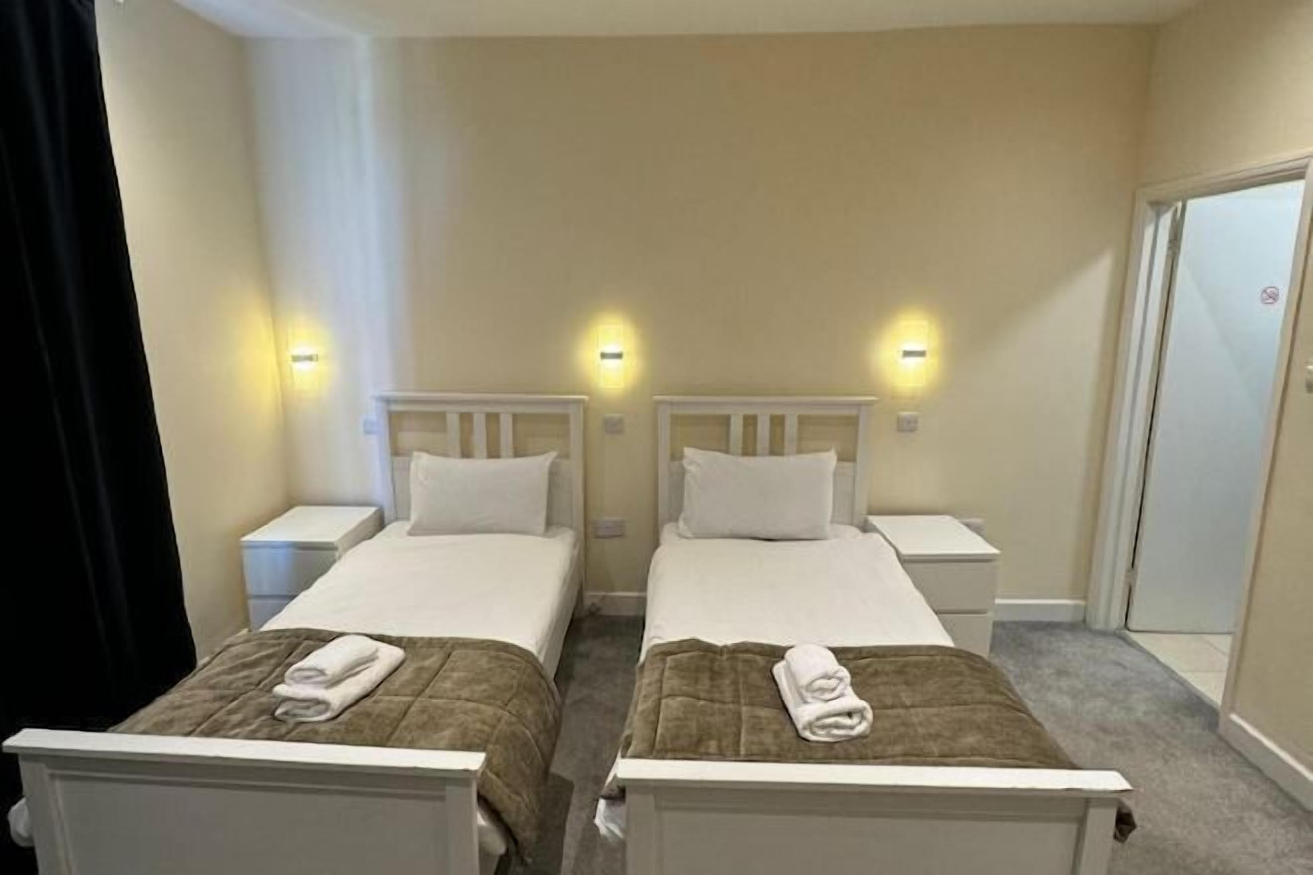 Desk, laptop workspace, blackout drapes, iron/ironing board