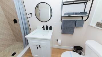 Shower, hair dryer, towels, soap