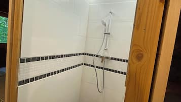 Shower, towels, soap, toilet paper