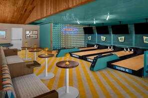 A billiards room with multiple tables and a neon sign. - Pool View 2 King | Golf, Beach & Tiki Bars (Stuart)