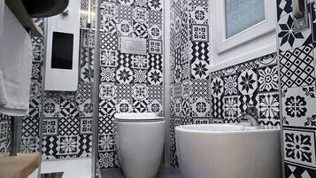 Shower, eco-friendly toiletries, hair dryer, bidet