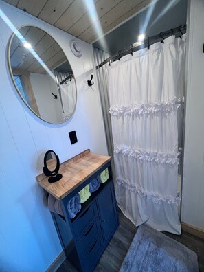 Shower, towels, soap, toilet paper