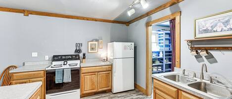 Fridge, microwave, stovetop, coffee/tea maker