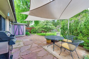 A patio with stone flooring, a grill, and outdoor furniture under a large canopy. - < 1 Mi to CU Boulder: Home w/ Fenced Yard! (Boulder)