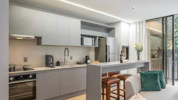 Comfort Apartment | Private kitchen | Full-size fridge, microwave, stovetop, coffee/tea maker